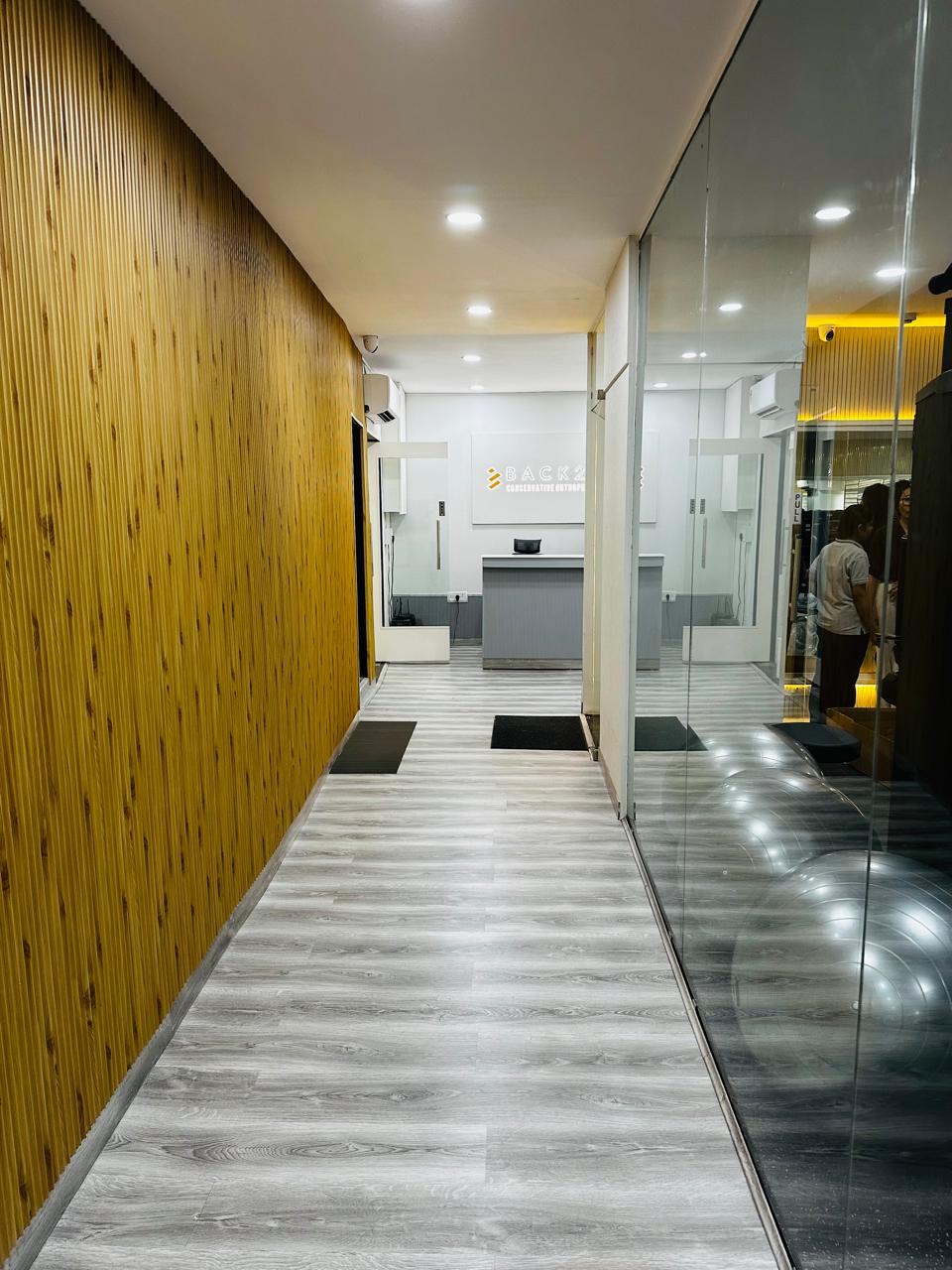 Back2Health entrance corridor with wood-panel feature wall